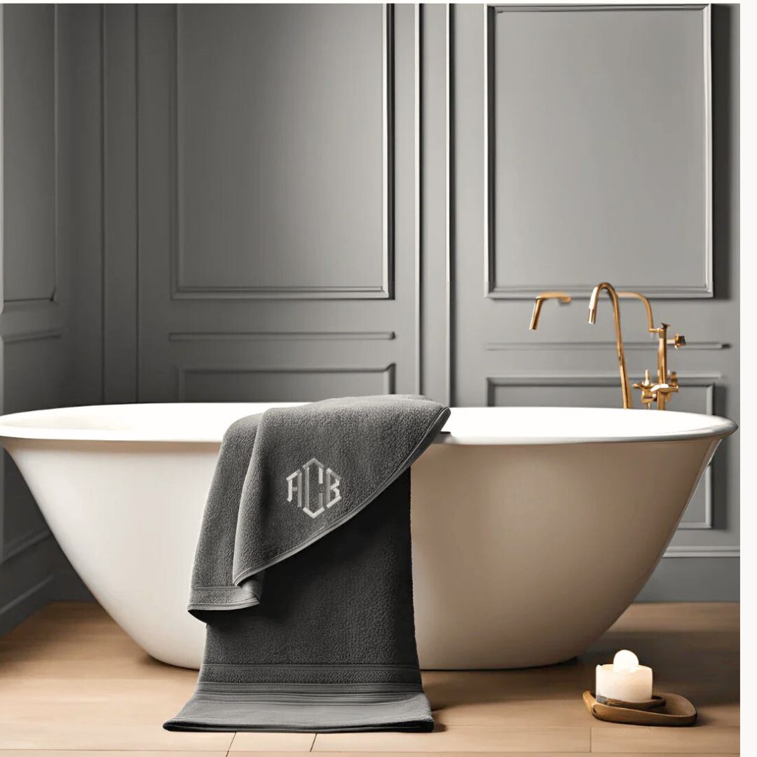grey organic cotton monogram bath towel in luxury bathroom