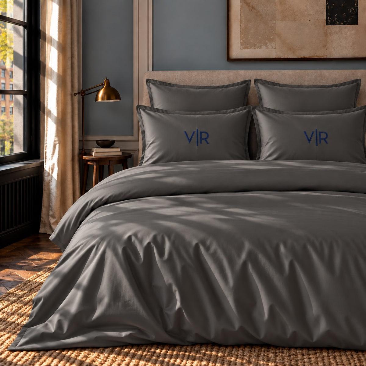 TYPEFACE 13 monogrammed bedding in space grey 500 TC sateen with navy monogram embroidered on pillowcases